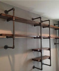 Wall-mounted shelves using Three Quarter Inch Black Malleable Iron Pipe Fittings Flange Tees And Elbow Set for DIY decor projects.