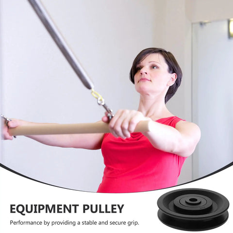 Person using gym equipment with 4 Pack Replacement Plastic Pulley Covers With Anti Slip Textured Grip For Home Gym Cable Machines.