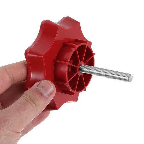 Close-up of red Spare Tire Mounting Bolt Kit For Volkswagen And Other Vehicles, Secure Hold Down Nut in hand.