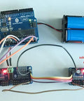 16 Channel 12 Bit PWM Servo Motor Driver Board With I2C Interface connected to Arduino and battery pack