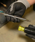 Technician holding 11-In-1 Multi-Bit Screwdriver And Nut Driver For HVAC Pros With Phillips Slotted Square And Schrader Bits