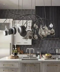 Modern kitchen with hanging pots, gray tile backsplash, and a large island featuring the Top Tier Light Oak Reactive Water Based Wood Stain Zero VOC Heavy Duty 55 Gallon Drum.