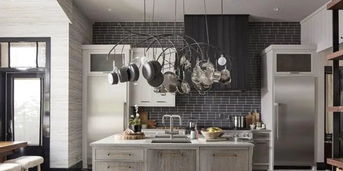 Modern kitchen with hanging pots, gray tile backsplash, and a large island featuring the Top Tier Light Oak Reactive Water Based Wood Stain Zero VOC Heavy Duty 55 Gallon Drum.