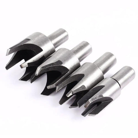 Built Tough Heavy Duty Eight Piece Wood Plug Cutter Set Forged From Premium Carbon Steel To Knock Out Screw Holes And Restore Furniture Fast Features Tapered Half Inch Round Shank Four metal plug cutters laid out in a row.