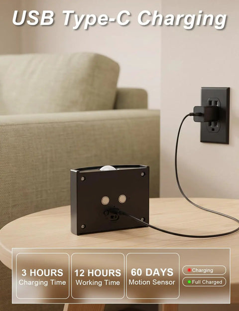 DEXULESA 2 Pack Motion Sensor Wall Light Magnetic Rechargeable Wall Sconce charging on a wooden table with USB Type-C connection.