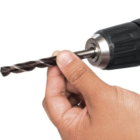 Close-up of hand holding drill bit for Ultra Compact 12V Max CXT Brushless Cordless Driver Drill With Smooth Handling And Rock Solid Motor For Knockout Torque And Serious Weekend Grind Sessions.