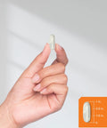 Hand holding Calcium With Vitamin D3 600 Mg Softgel, size guide showing 1 inch, for Strong Bones and Daily Health, Gluten Free