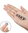 Hand holding Four Pieces from Eight Piece Dowel And Tenon Center Transfer Plugs Set For Woodworking, Heavy Duty Steel Alignment Pins With Chrome Finish, Includes 6mm 8mm 10mm 12mm Centers And 1/4 5/16 3/8 1/2 Inch Sizes For Precise Hole Alignment.