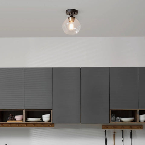 Harrow 1 Light Semi-Flush Mount Ceiling Light With Matte Black Finish, Gold Accent Socket, Clear Glass Shade, in kitchen setting