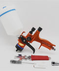 Professional 1.3mm Airbrush Spray Gun Kit With Adjustable Air Regulator And Inline Moisture Filter, orange body with container and accessories.