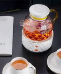 800 Ml Portable Electric Kettle For Car And Truck Rides Quick Boil Vacuum Insulated Water Heater shown with tea and cups.