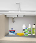 Under Sink Mat For 36 Inch Cabinets Silicone Waterproof Liner Protects Against Leaks Drips And Spills Gray 35 By 22.5 Inch Holds Over 3 Gallons Keeps It Dry Easy Clean Up With Durable Silicone Non Slip Edges For Quick Hassle Free Maintenance under kitchen sink with cleaning products and supplies displayed on mat