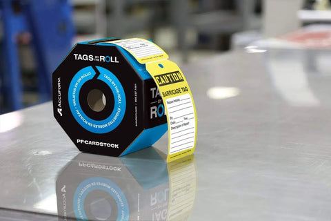 NMC 100 Safety Tags By The Roll Caution Barricade OSHA Compliant Waterproof 6.25x3 Inch PF Cardstock in octagon dispenser.