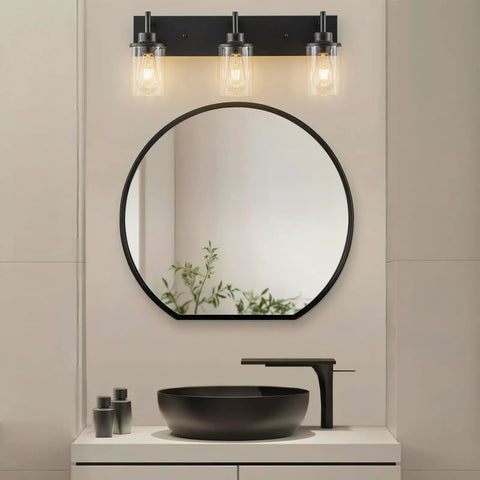 Two Light Black Industrial Vanity Light Sconces With Clear Glass Shades above bathroom mirror and sink