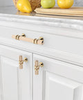 10 Pack Knurled Gold Cabinet Pulls Slick 5 Inch Long 3 Inch Center Hole Brushed Brass Kitchen Cabinet Handles on white drawers