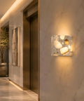 4.7" Mid Century Modern Wall Sconce, Minimalist Terrazzo Wall Light Fixture illuminating a stylish hallway.