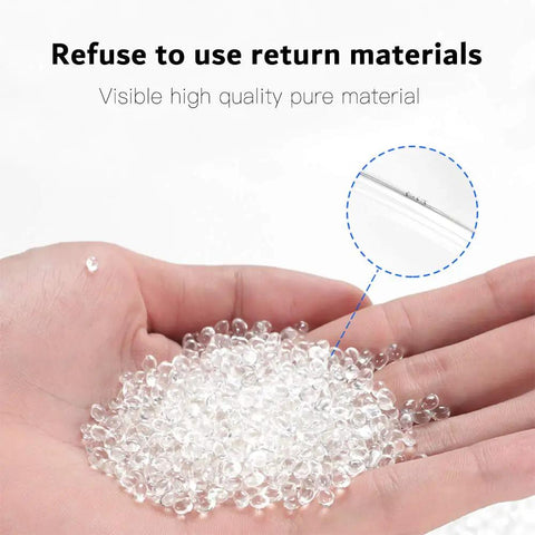 Close-up of hand holding clear pellets for Flexible PU Tubing For Air Compressors And Fluid Transfer Black 32.8 Ft Air Hose