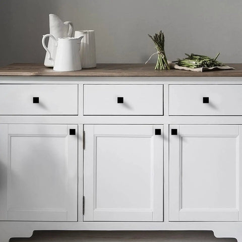 Twelve Pack Matte Black Square Cabinet Knobs Solid Zinc Alloy Drawer Pulls Heavy Duty Hardware on white cabinet.