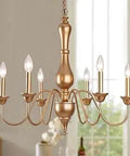 Gold Modern French Country Farmhouse Chandelier With 6 Lights, Metal Candle Pendant Light Fixture hanging in a room.