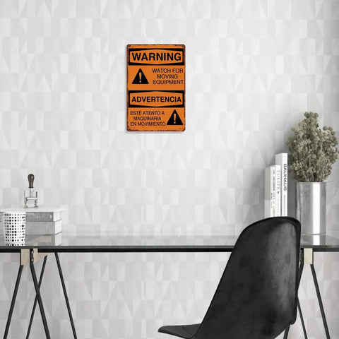 Warning Moving Equipment Metal Sign 8x12 Inch Aluminum Wall Decor displayed in a modern workspace