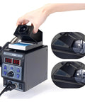 Hand adjusting 2 In 1 SMD Soldering Station With Hot Air Gun And Soldering Iron, Dual Digital Display. Ideal for electronics repair.