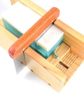 Close-up of adjustable wood cutter from DIY Soap Making Cutting Kit With Two Purple Silicone Molds In Wood Boxes and soap bar inside.