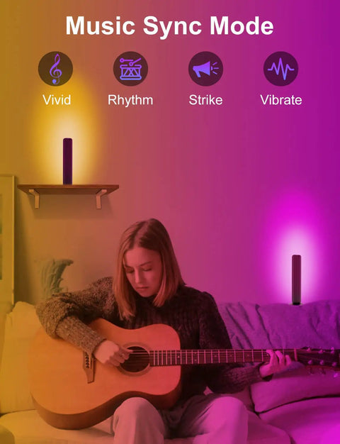 Woman playing guitar with Lit RGBICW Smart Light Bars for TV PC and Gaming Setup with Scene and Music Sync, ambient lighting.