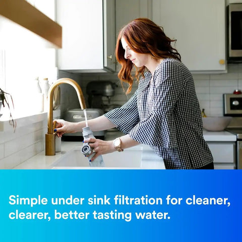 Woman using Maximum Under Sink Water Filtration System That Kills Lead And Chlorine Taste Blocks Microbial Cysts And Asbestos