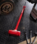One Piece Sledge Head Dead Blow Hammer 6-1/2 Lb Made In USA Non Sparking Polyurethane Body with steel shot chamber in garage