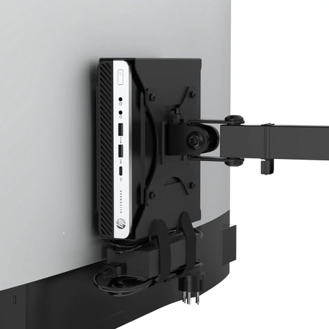 Rock Solid Vesa Mount Bracket For HP Desktop Mini Prodesk And EliteDesk Rigs mounted behind a monitor holding cables neatly.