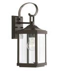 Gibbes Street Collection 1 Light Outdoor Wall Lantern in Antique Bronze with clear beveled glass, front view, bulb visible.