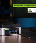 Edge AI Beast J4012 with NVIDIA Jetson Orin NX 16GB for Vision AI on desk next to a computer monitor.