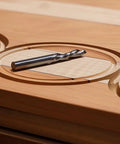 Pro Level Upcut Spiral Router Bit Featuring Solid Carbide Construction And A Quarter Inch Shank on wooden surface for circle cutting