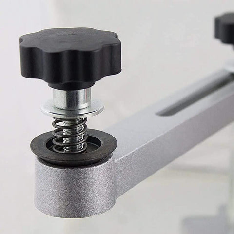 Close-up of tilt arm adjustment knob of High Caliber 120 Volt Electric Circular Saw Blade Sharpener Packed With Diamond Emery Wheels Portable Aluminum Base Adjustable Tilt Arm For Hella Clean Cuts And Slick Daily Grind.