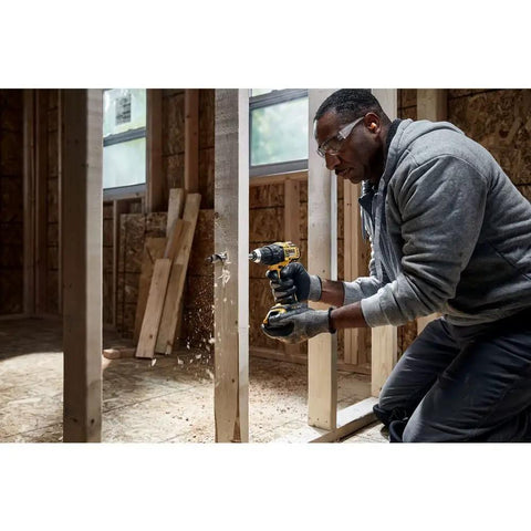 Heavy Hitter 20V Max Brushless Compact Drill Driver Boasting 1/2 Inch Ratcheting Chuck And 404 Uwo Torque, Pumping Out 1650rpm Revolutions Plus Bright Led Lights For No Sweat Job Site Hustle, Tool Only in use on construction site.