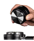 Get The Most Out Of Your Home Machine With This Slick Dual Bearing Espresso Distributor Compatible With Breville Barista And IKAPE Portafilters In 51 54 58 Mm Sizes, showing hand holding the distributor.