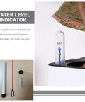 Six Pack Floating Indoor Pot Moisture Probes And Water Level Indicators For Potted Plants inserted in a pot near a leaf