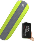 All Season Self Inflating Camping Pad With 4.3 R-Value Insulated Foam next to compact carrying bag in hand