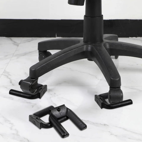 Lock And Load Your Rolling Ride With This Bulletproof 4 Pack Of Non Slip Rubber Wheel Stopper Bed Frame Caster Blocker Heavy Duty Floor Anchor Secures Office Chairs Desks Couches Tight No More Drifting Wheels, close up of black rubber wheel stoppers under a rolling chair.