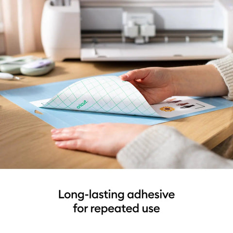 Close-up of hands using LightGrip Cutting Mat Pack 6 Pack 12x12 Inches For Lightweight Paper Cardstock And Printables Reusable Durable Mats With Long Lasting Adhesive That Wont Crack Compatible With Explore And Maker Series.