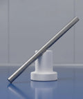 Real Deal Heavy Duty 5 Pack 5Mm X 100Mm Stainless Steel Precision Shaft Rod displayed on a white stand for RC car axle replacement.