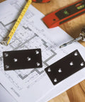 Black Stainless Steel Corner Brackets Set Of 10 With Protective Coating shown on blueprint with drill and tools
