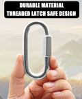 Hand holding Two Pack M8 5 16 Inch Heavy Duty Stainless Steel Quick Link Carabiners with threaded latch against mountain background.