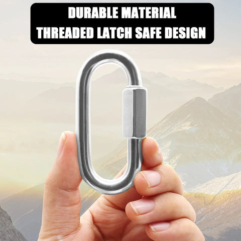Hand holding Two Pack M8 5 16 Inch Heavy Duty Stainless Steel Quick Link Carabiners with threaded latch against mountain background.