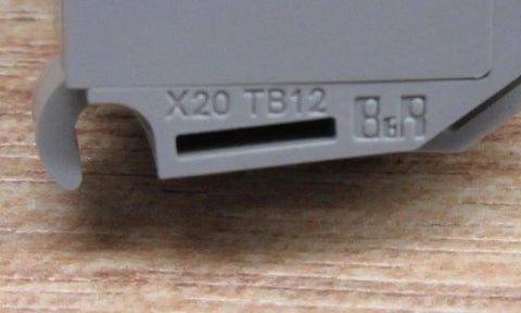 Close-up of X20 12 Pin Terminal Block With Push In Connectors, showcasing the label and push-in slots for 10 Amp wiring.