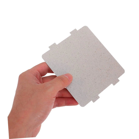 Hand holding a 10 Pack Microwave Waveguide Cover Mica Sheet, universal fit for heat insulation and repair, cuttable to size, durable replacement part.