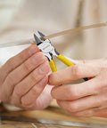 BOOSDEN Wire Cutter, 6.5-inch, yellow-handled side cutters cutting a flat ribbon cable