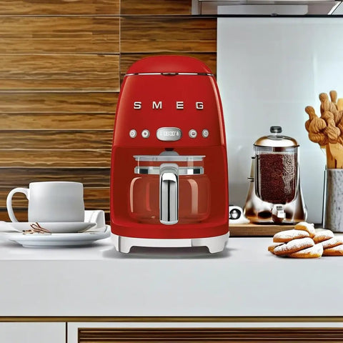 Boost Your Daily Grind With This Smooth Operator Retro Drip Coffee Maker Featuring 10 Cup Glass Carafe Programmable Auto Start Keep Warm Plate And Dual Strength Settings In Bold Red on a kitchen counter.