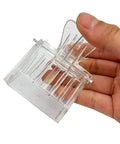 Hand holding Clear Queen Bee Cage Catcher Clip Set For Beekeeping Tools Beekeeping Essentials Spring Loaded Queen Grabber with plastic build