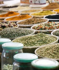 Display of various herbal powders and spices similar to Root Extract Powder 100 Grams Non Edible Use in bowls and jars.